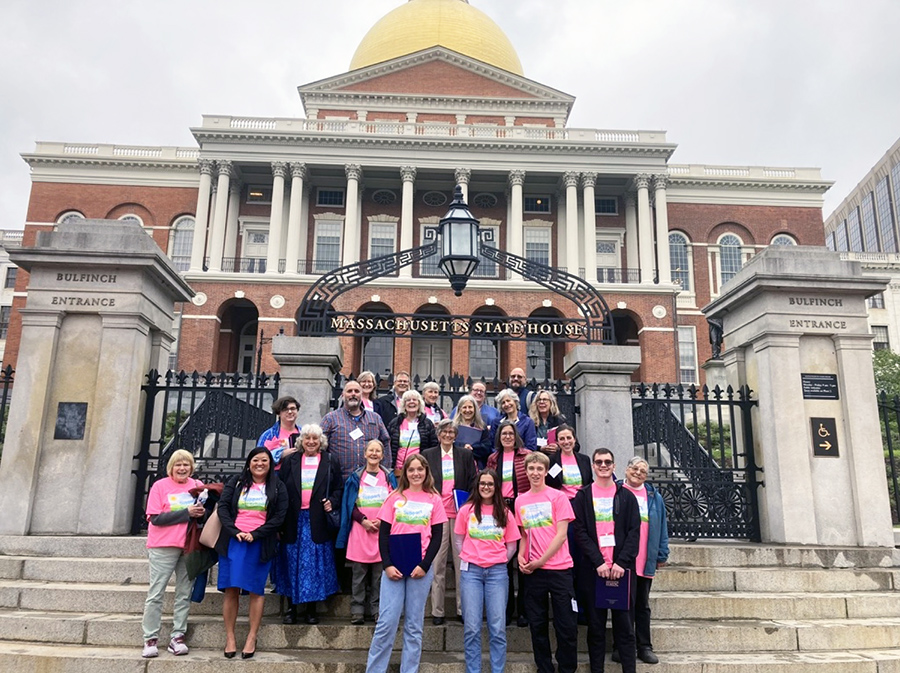 Staff group photo in front of Massachusetts State House